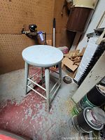 Full view of wooden stool in workshop setting