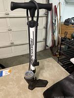 Air Boost floor bike pump with T-handle and pressure gauge at the base