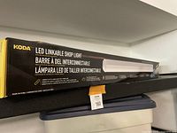 Showing front of box for KODA LED Linkable Shop Light with product branding and description