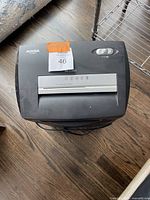 Top view showing control switch, paper slot, and brand label 'Aurora' on shredder.