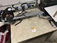 Full view of the Thule hitch bike rack with 4 bike holders laid on a table.