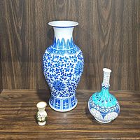 Three vases shown together: large blue & white porcelain, Turkish handmade blue & turquoise vase, and mini ceramic vase.