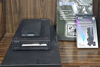 Vintage GRiDCase 3 Plus laptop closed, showing carry case and external floppy disk drive