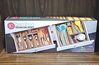 Photo of the bamboo organizing boxes set packaging showing the 10 piece set with example items stored