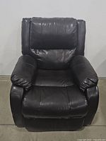 Front view of dark brown leather power recliner.