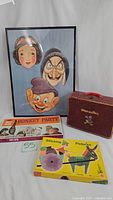 Framed Disney masks, vintage travel case, Donkey Party game box, Stitching Pictures craft kit box