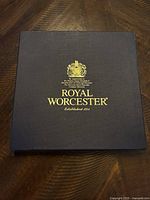 Closed Royal Worcester branded box with gold text and crest, indicating established 1751