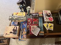 Overview photo of all vintage trinkets items arranged closely showing the variety and packaging condition.