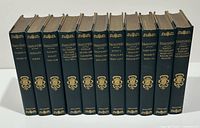 Full set of eleven volumes showing gilt-stamped spines