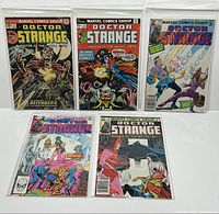 Full view of five Marvel Doctor Strange comic books, issues #2, 13, 48, 53, and 60, arranged in a display with bags and boards.