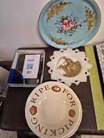 Five various ceramic and glass items: blue flower plate, 'Ripe For Picking' plate, horse rider motif plate, blue patterned plate, and glass letter holder