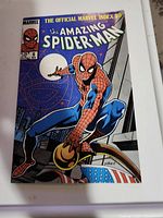 Front cover of The Amazing Spider-Man #8 comic book showing Spider-Man crouched on city rooftop with moon and stars in background.