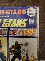 Close up corner and edge detail showing wear and damage on DC Super Stars #1 comic cover.