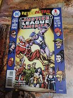 Full front cover of JLA Retroactive Justice League of America comic issue showing all featured characters and text.