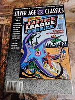 Full cover of The Brave and the Bold #28 comic book with Justice League of America theme, Silver Age Classics series, showing price and publisher info.