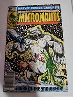 Front cover of Micronauts #32 comic showing a large white bear creature and characters with weapons