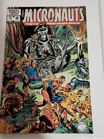 Front cover of Micronauts comic book #46 showing colorful action scene with skeleton figure and other characters.
