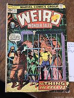 Front cover of Weird Wonder Tales issue #5 showing characters behind bars and title text.