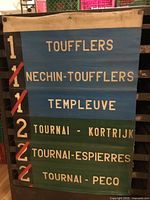 Front of canvas streetcar sign showing route numbers and destinations