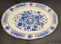 Top view of the European blue and white floral oval ceramic platter showing detailed floral pattern centrally and along the border.