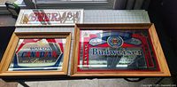 Three vintage beer bar signs on a table: Molson Canadian Lager, Budweiser King of Beers, and Beer 5 cents glass sign.