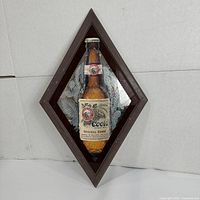 Front view of diamond-shaped mirror with Coors Light bottle image inside dark brown frame