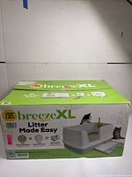 Packaged box of Arm & Hammer Breeze XL cat litter box featuring product branding and usage images