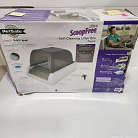 Front view of the PetSafe Ultra ScoopFree Self-Cleaning Litter Box box showing product image and features.
