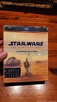 Front cover of the Blu-Ray set showing Star Wars The Complete Saga title, sealed in plastic shrink-wrap.