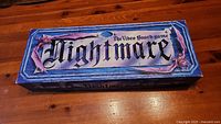 Closed box of Nightmare VHS video board game with gothic style title graphics on the lid