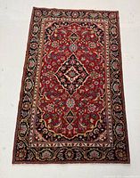 Full view of rug laid flat showing entire design and condition