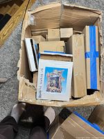 Overview of large shipping box with various smaller boxed items