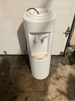 Full view of Culligan water cooler showing taps and cord