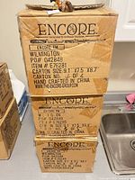 Three stacked Encore boxes item #E76281