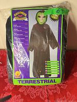 Front of packaged alien costume showing contents and Terrestrial branding