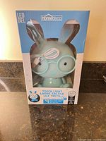 Retail package front showing Homedeco LED rabbit night light in mint color