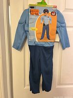 Front view of packaged costume showing padded top and pants