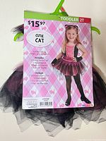 Front of packaged toddler cat costume set showing model image, size 2T, price $15.97
