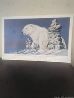 Photo showing the full lithograph artwork depicting a polar bear and rock formations with a white border around.