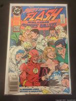Full cover front image showing The Flash comic book cover art with party scene and text noting free second feature book.