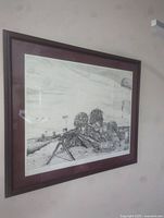 Framed black and white detailed pointillism print showing two soldiers with helmets aiming a machine gun with parachutes in the background