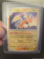 Front of the Raichu Pokémon card showing the character, stats, and attack details with reverse holo shimmer.