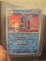 Wartortle card number 8 from Scarlet & Violet Blooming Water set in clear protective plastic showing front artwork and text.