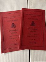 Two red RCMP Graduation Exercise booklets for Troop 11 from 1973 showing front covers with the event date and troop info.