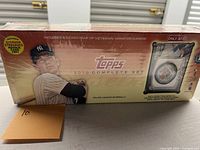Sealed 2010 Topps Complete Set factory box showing Yankees player image and sealed plastic shrink wrap