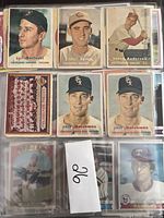 Front sides of multiple vintage baseball cards including player portraits from Cleveland Indians, Cincinnati Reds, Philadelphia Phillies, Chicago White Sox and Texas Rangers.