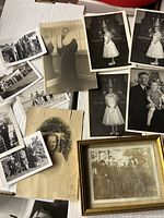 Overview of 12 vintage black and white photographs showing variety of sizes and subjects including posed portraits and group shots.