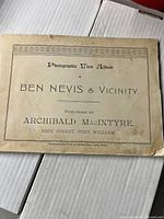 Front cover page showing title 'Photographic View Album of Ben Nevis & Vicinity' published by Archibald MacIntyre, High Street, Fort William.