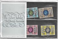 Photo of the sealed card sheet of four 1977 Queen Elizabeth Silver Jubilee British Post Office mint stamps.