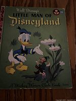 Front cover of Walt Disney's Little Man of Disneyland showing Donald Duck and the title text.